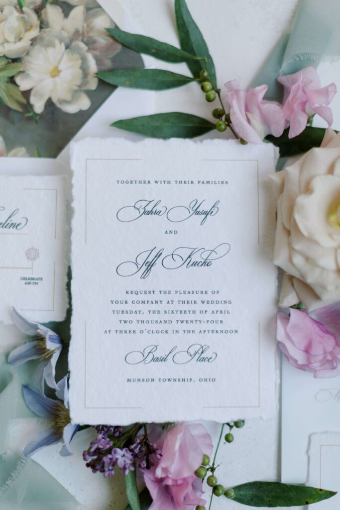 Whimsical deckled edge wedding invitation on handmade paper for an outdoor wedding