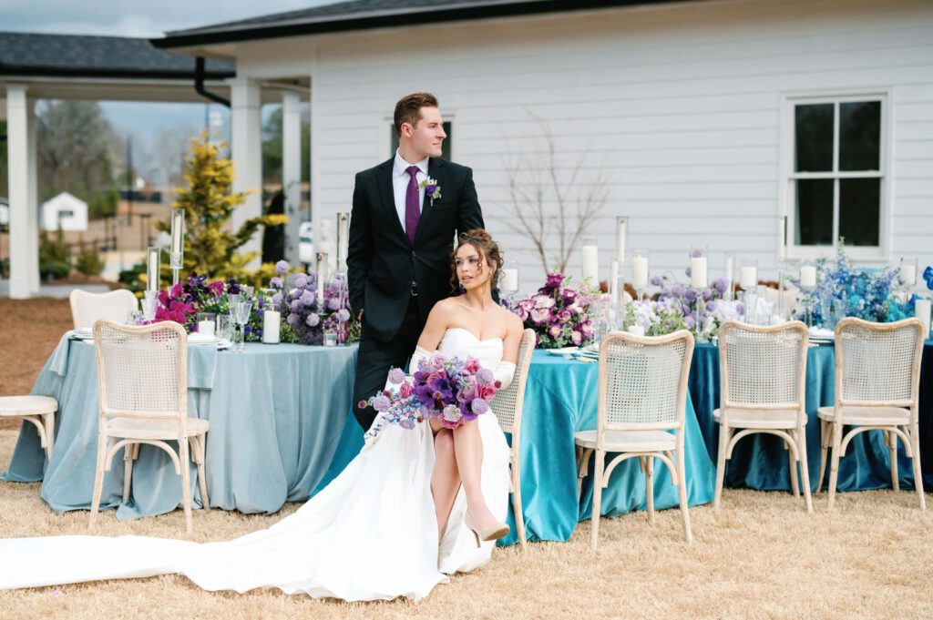 Bride and groom at colorful outdoor wedding reception at Whitestone Reserve