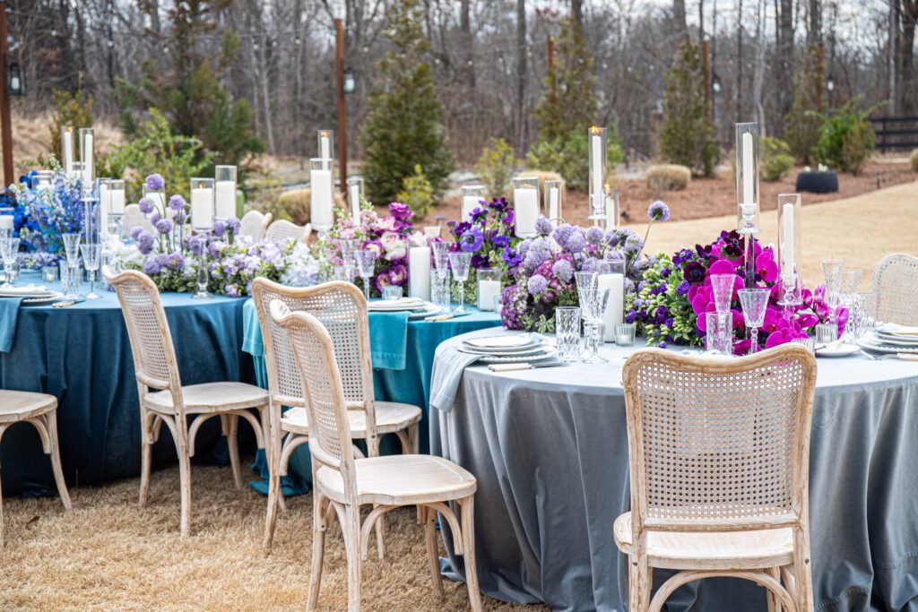 Outdoor wedding reception tables with colorful wedding floral inspiration