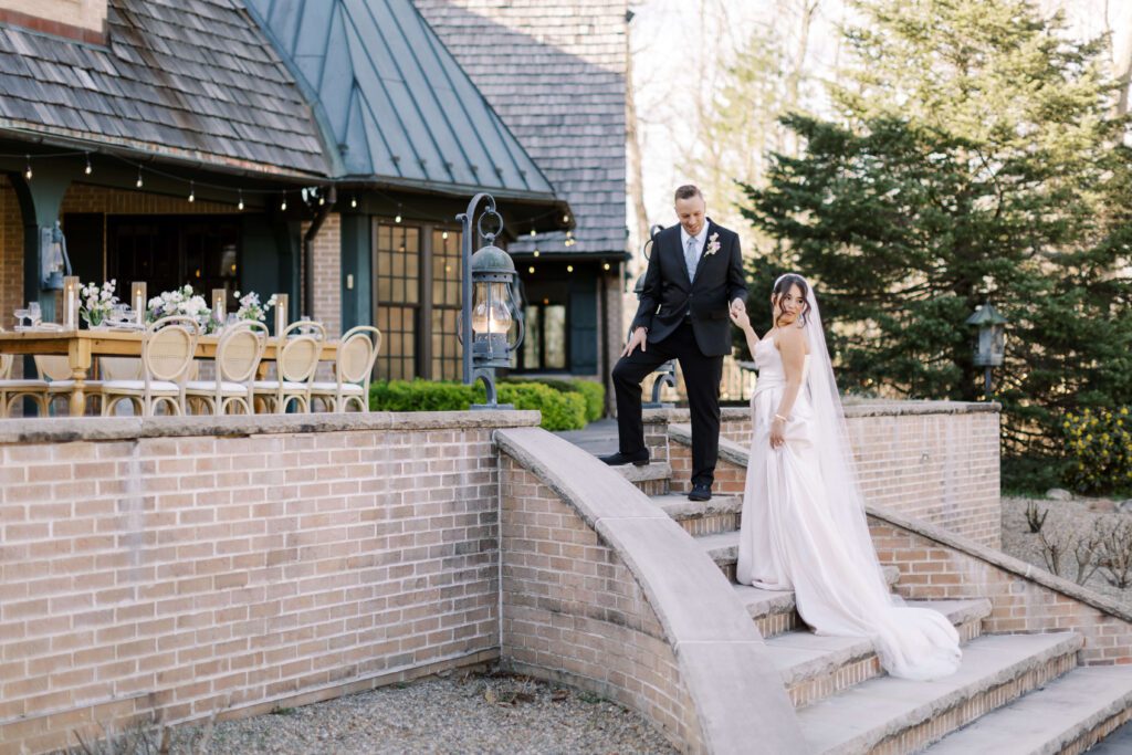 Bride and groom on patio steps at Basil Place