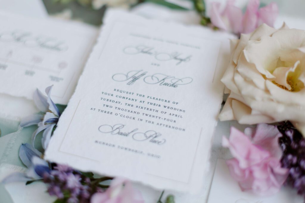 Custom deckled edge wedding invitation card on handmade paper