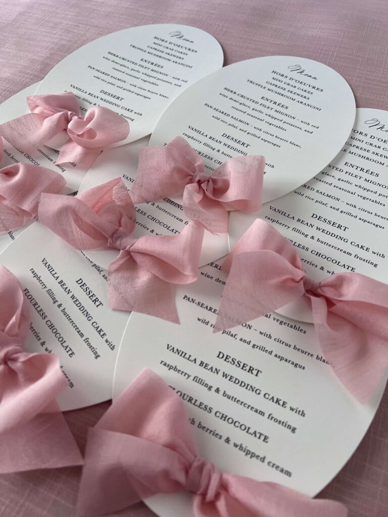 Wedding menu cards with pink bow