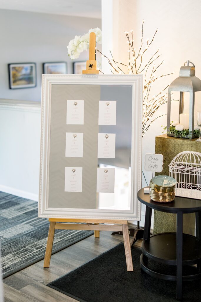 Wedding seating chart cards fixed to a mirror