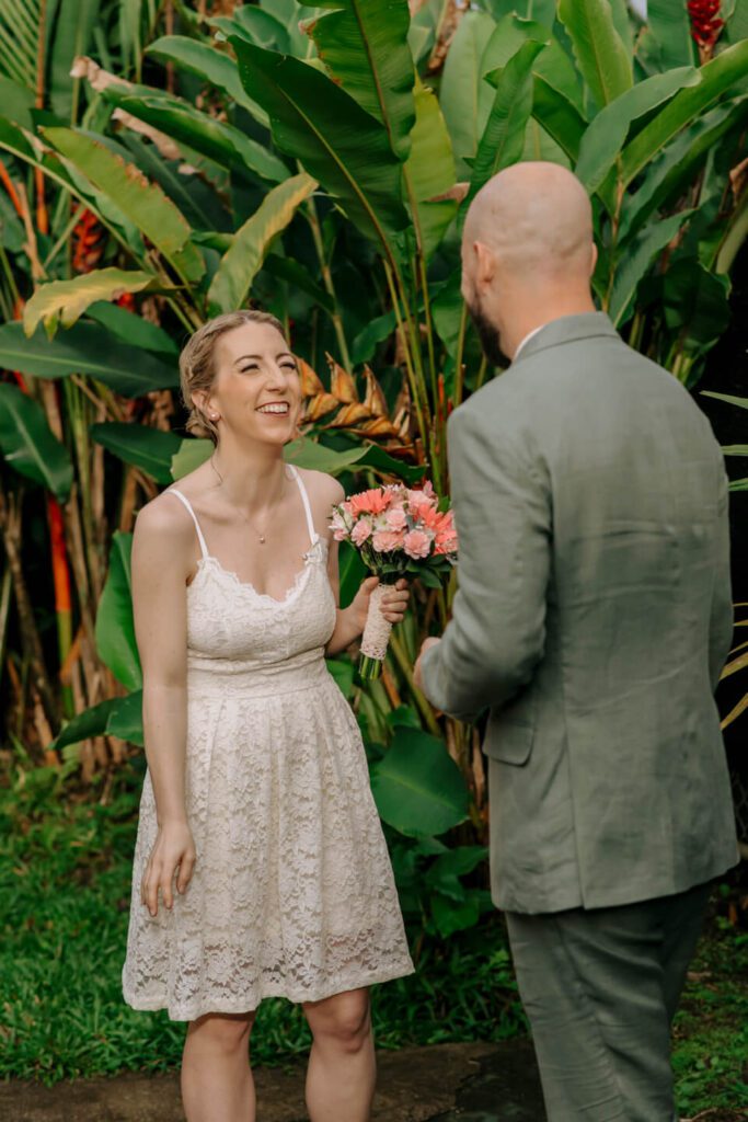 Bride smiling at groom during their first look