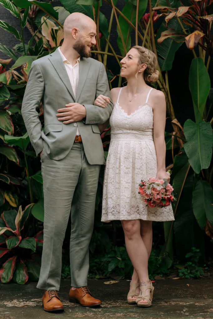 Bride and groom exchanging smiles on the day of their wedding