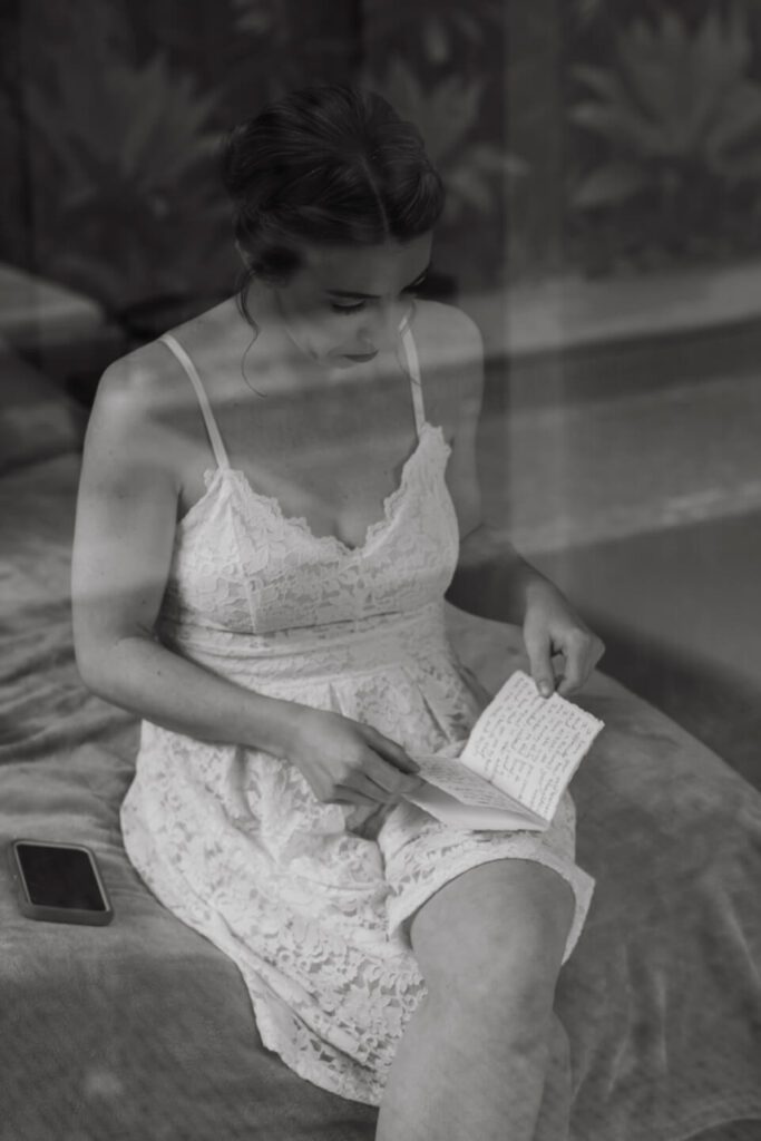 Bride reading her wedding vows in private on the morning of her elopement in Costa Rica
