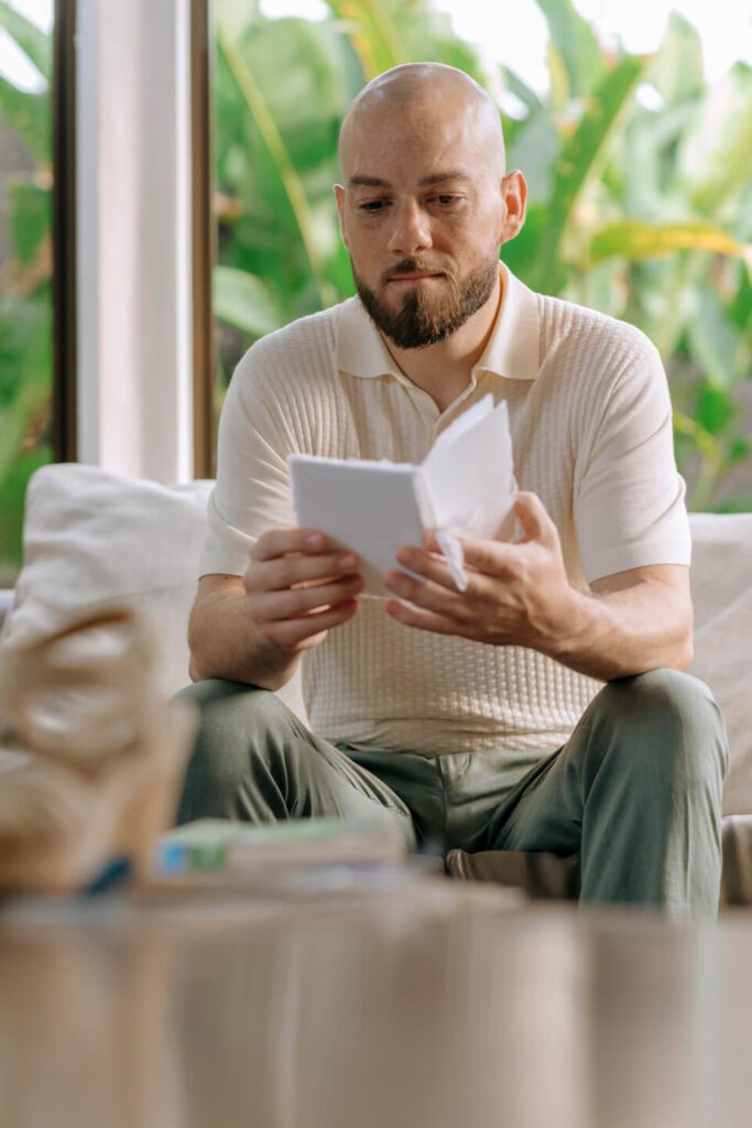 Groom privately reading his wedding vows on the morning of his elopement