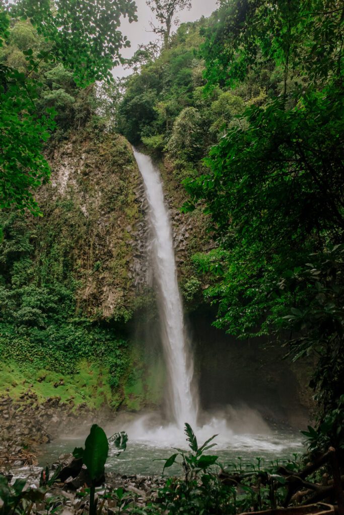 Lush greenery surrounds La Fortuna Waterfall in Costa Rica