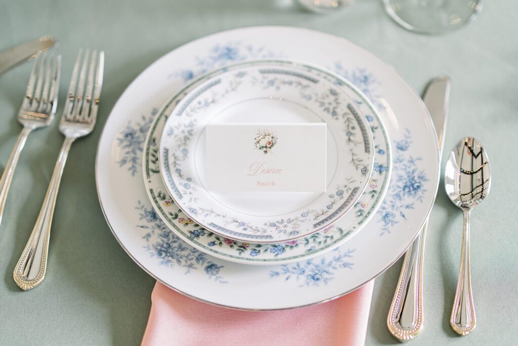 Vintage floral wedding reception plates with an elegant floral watercolor place card