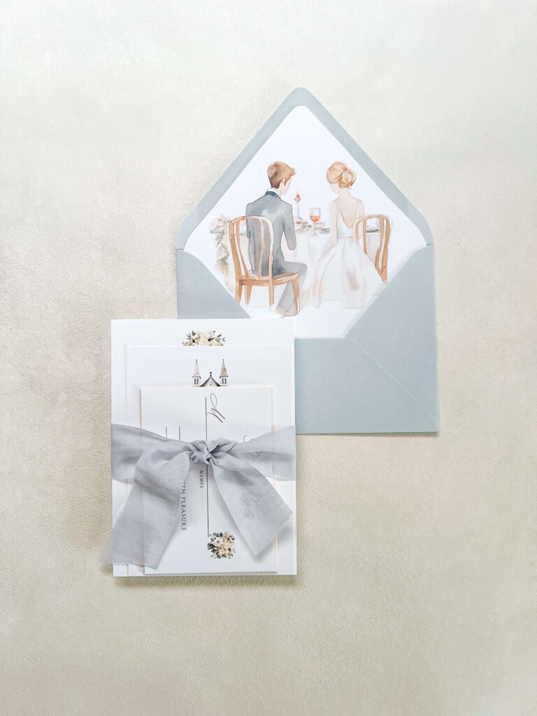 Wedding invitation suite with watercolor artwork of bride and groom in envelope