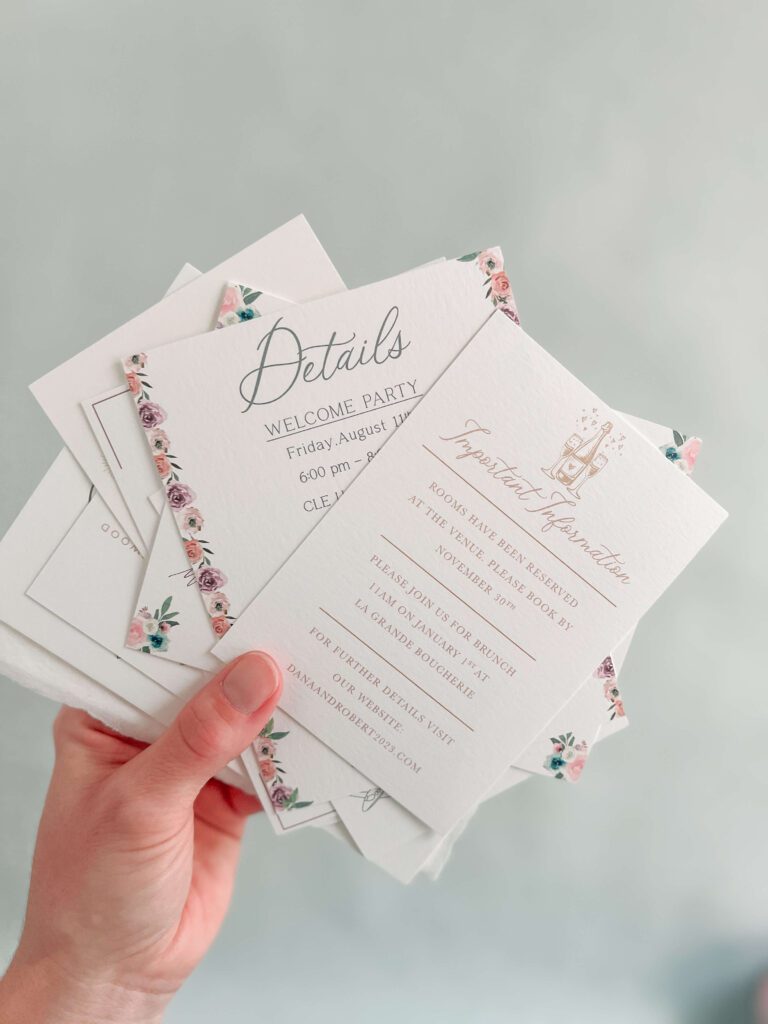 An array of wedding invitation details cards that provide information for destination wedding invitations