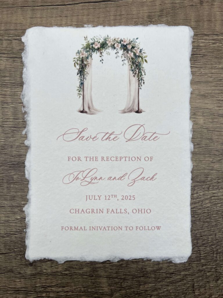 Whimsical save the date card featuring a romantic watercolor wedding arch and elegant script font