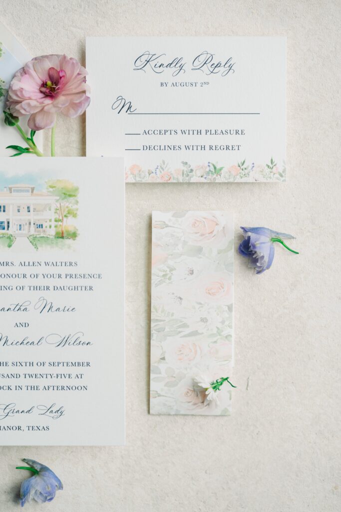 Elegant wedding invitation suite featuring watercolor floral artwork