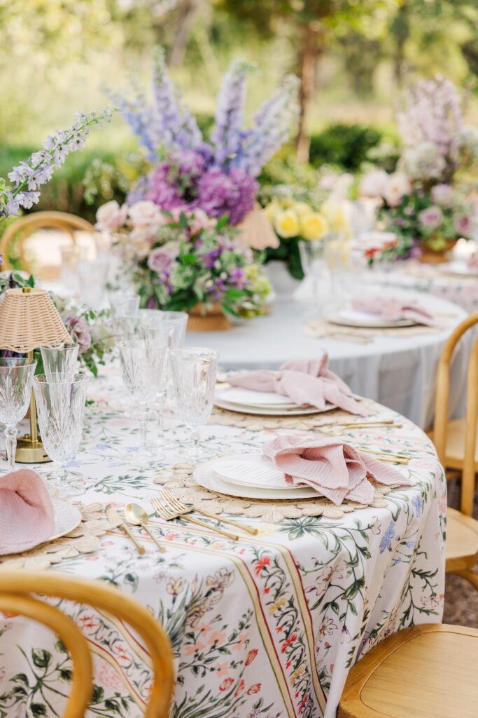 Whimsical table setting with floral patterned tablecloth