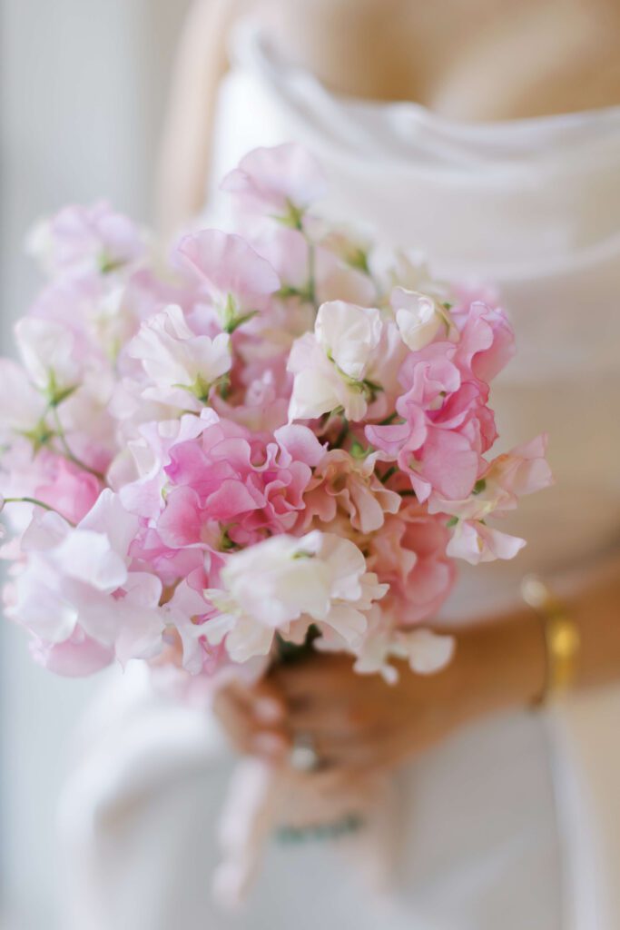 Delicate bridal bouquet of pink and cream flowers