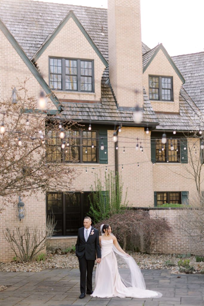 Bride and groom in front of Northern Ohio wedding venue Basil Place