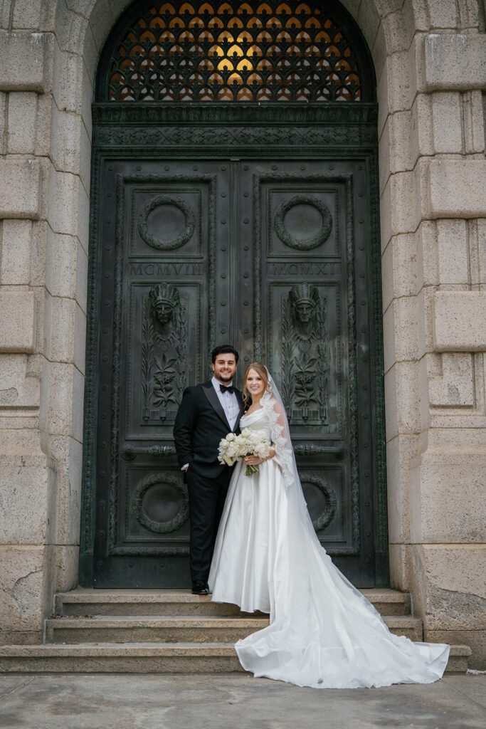 Bride and groom standing outside The Old Courthouse, a Northeast Ohio wedding venue