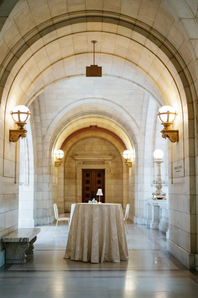 Cocktail hour table in an elegant marble courthouse