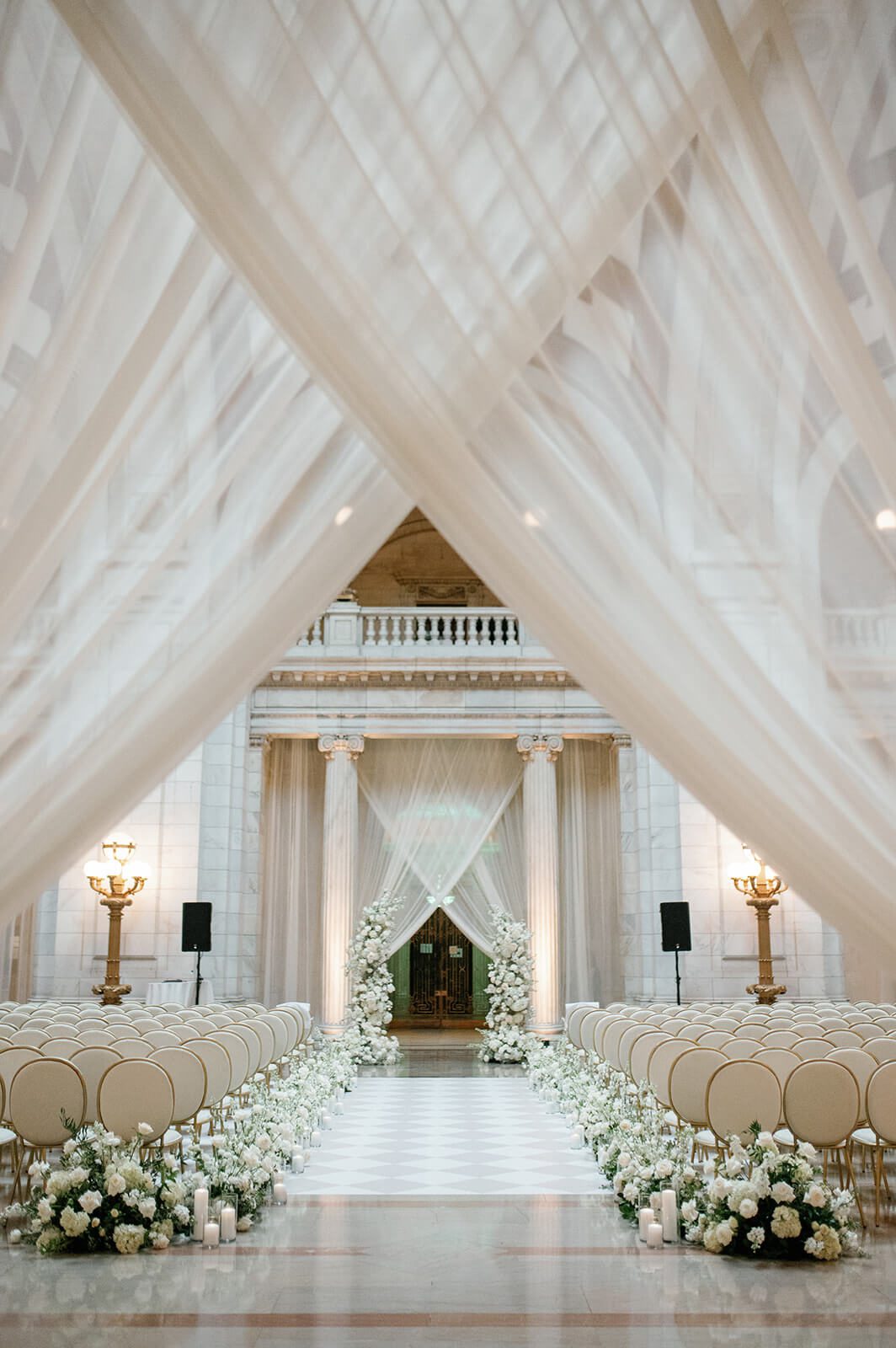 Wedding ceremony setup with white draping in The Old Courthouse in Cleveland