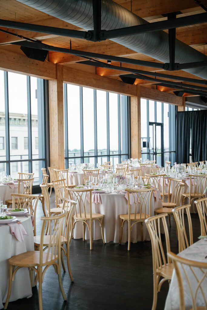 Industrial yet elegant wedding reception tables set up in Truss, a Northern Ohio wedding venue