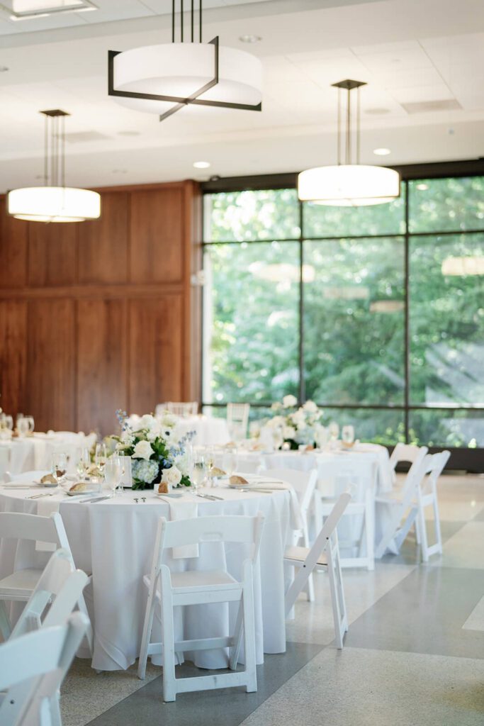 Modern and elegant all white wedding reception tables