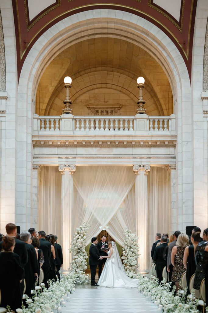 Wedding ceremony with white draping in The Old Courthouse in Cleveland