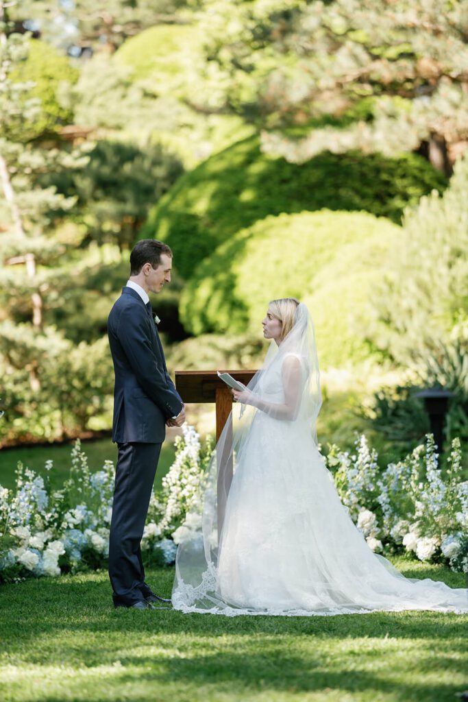 Bride and groom during their wedding ceremony at the Cleveland Botanical Garden