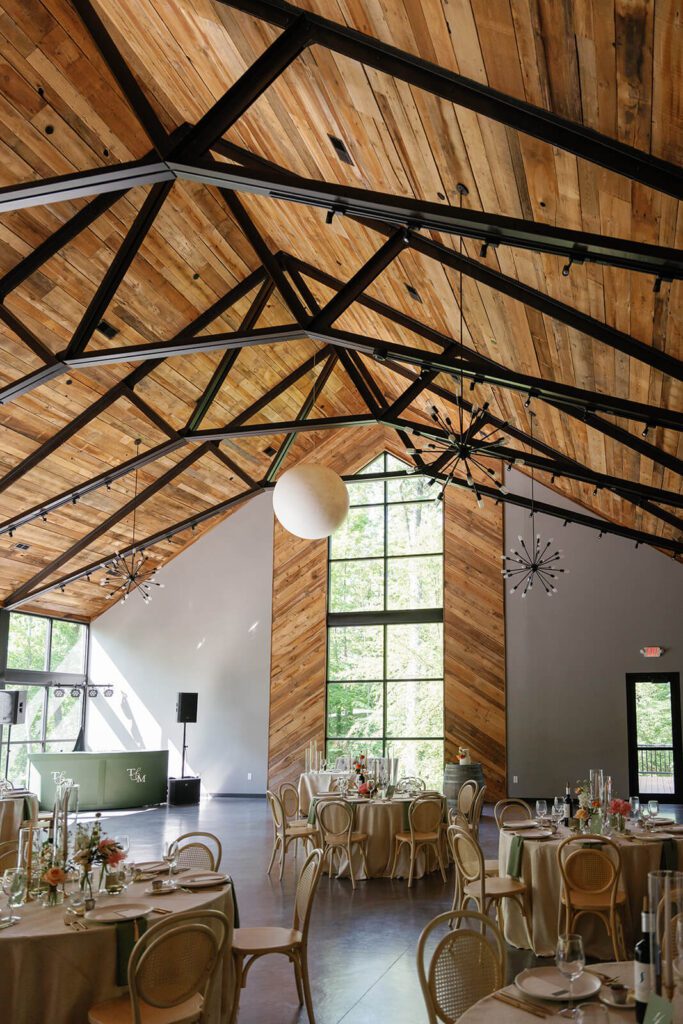 Modern and rustic wedding venue with a wooden vaulted ceiling
