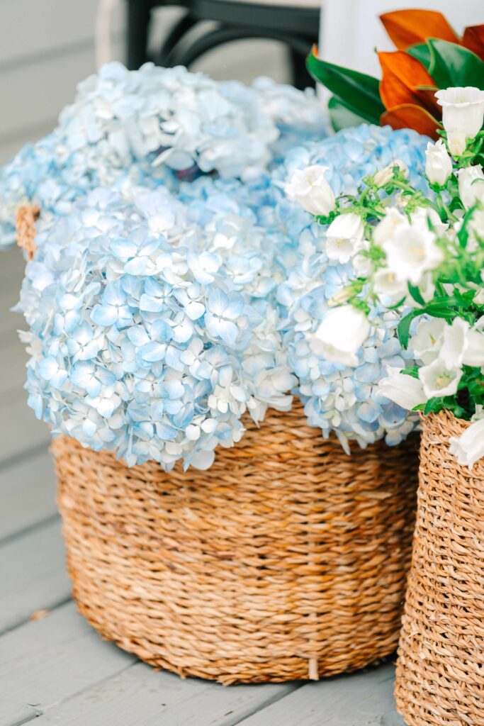 Basket of hydrangeas displayed for a wedding reception
