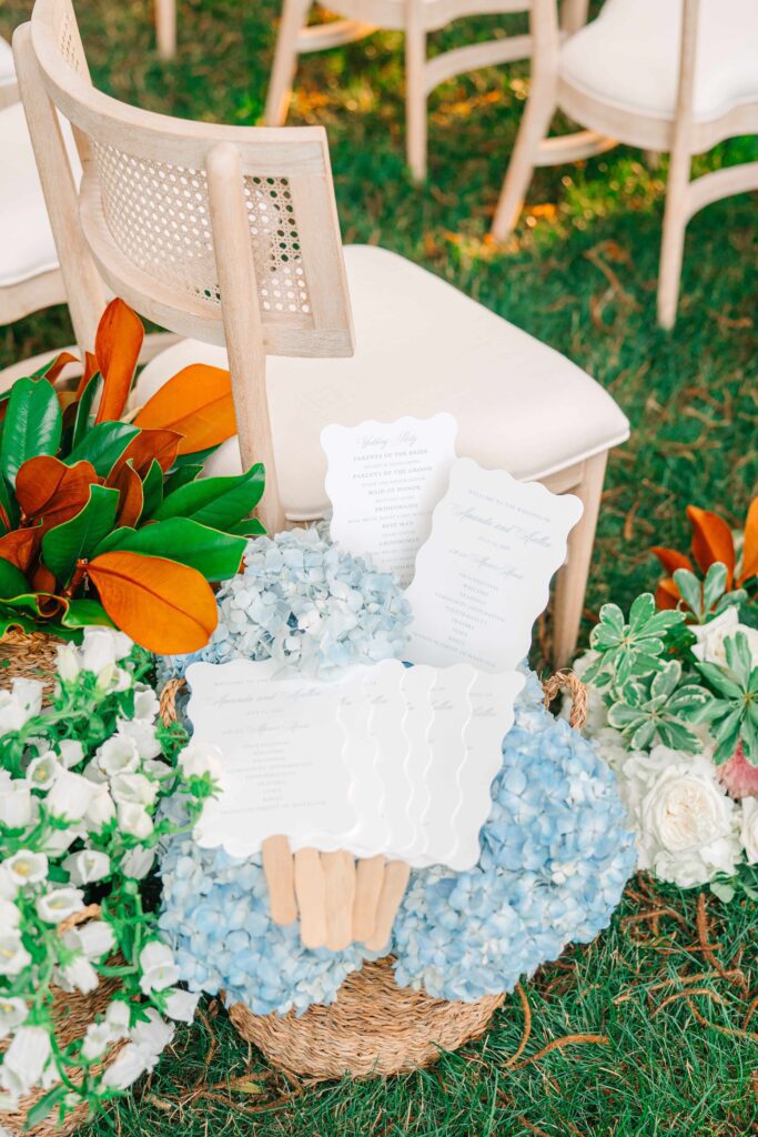 Wedding ceremony program fans displayed for guests