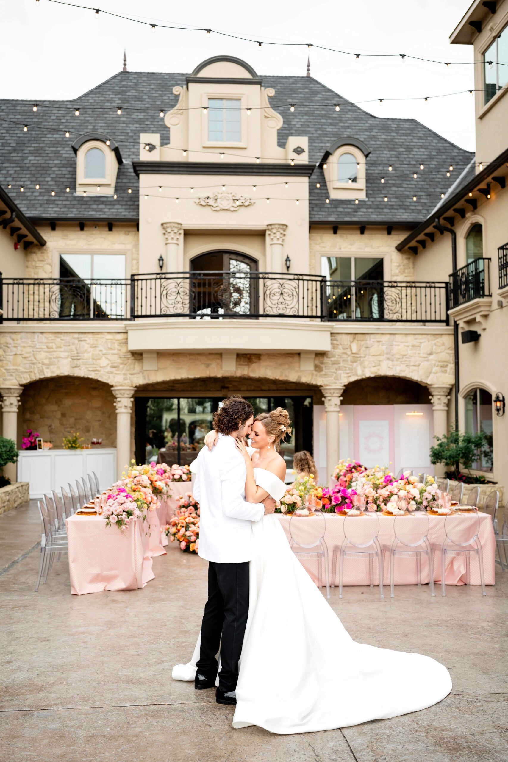 Bride and groom at their courtyard garden party wedding reception at Knotting Hill Place in Texas