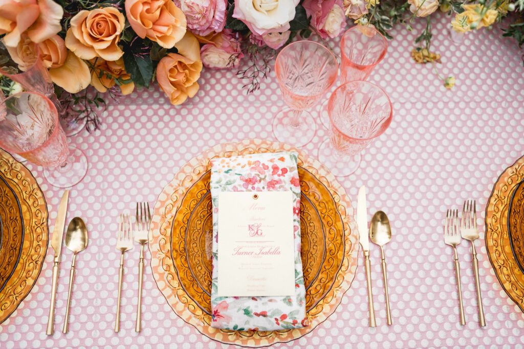 Elegant light yellow wedding reception menu on floral napkins