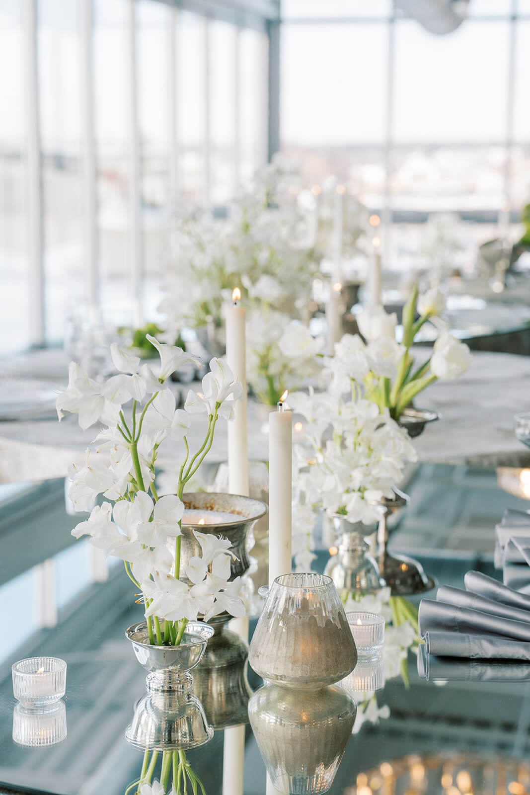 Elegant and ethereal white and green florals for a wedding at Revery North 4th Corridor