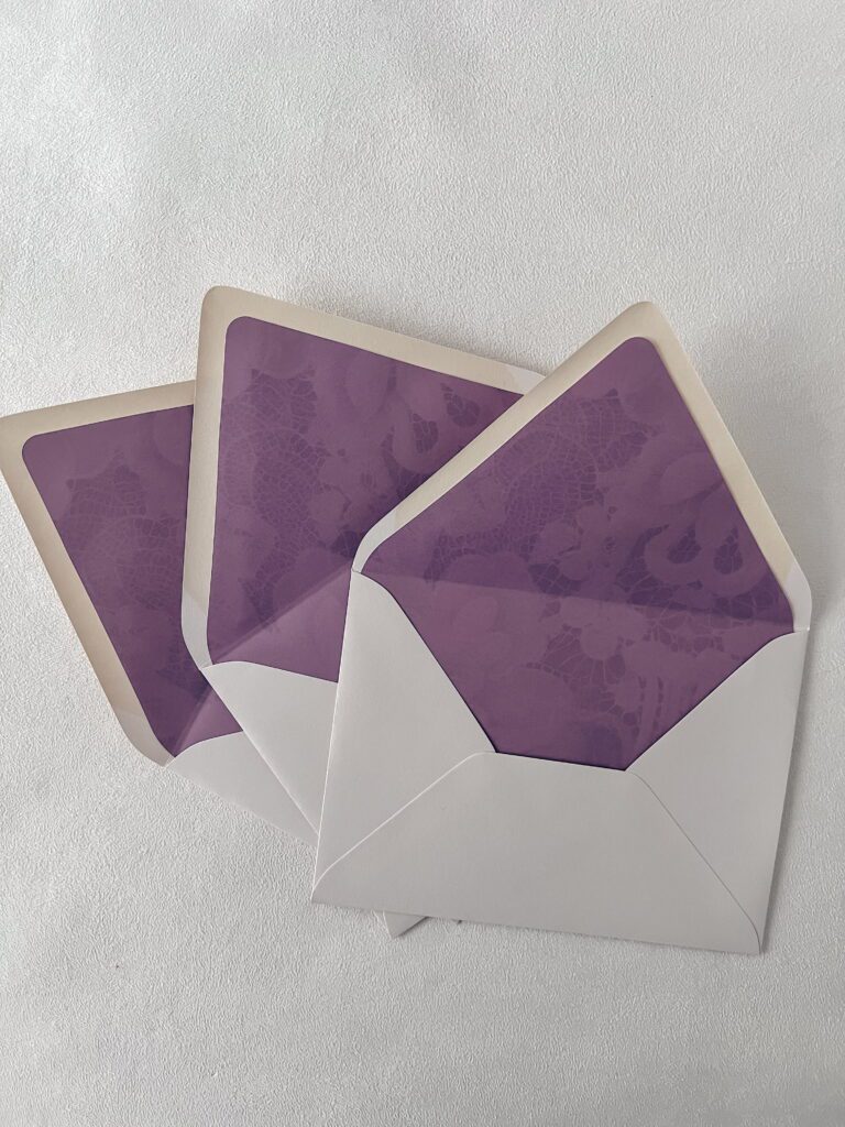 Romantic wedding invitation suite with purple envelope liner