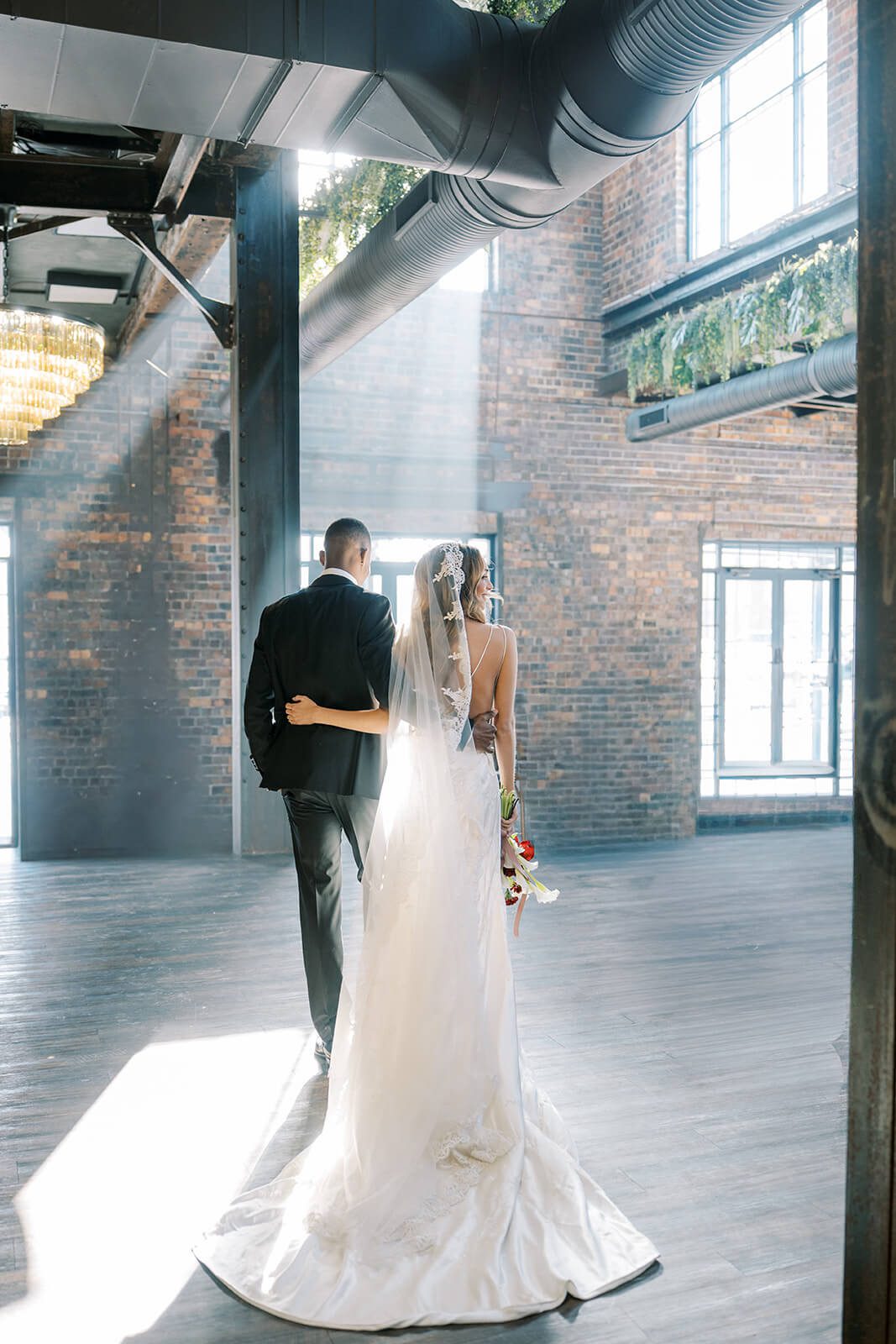 Bride and groom in industrial-chic wedding venue Brick and Mortar Columbus