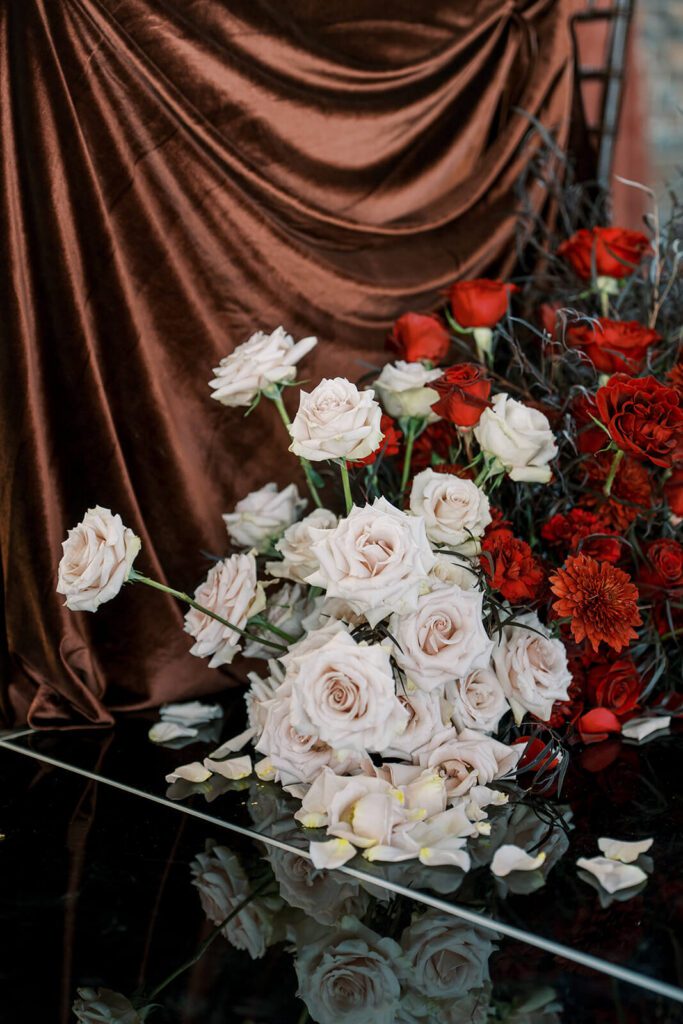 Romantic floral arrangement of blush and red roses for a ceremony at Brick and Mortar Columbus