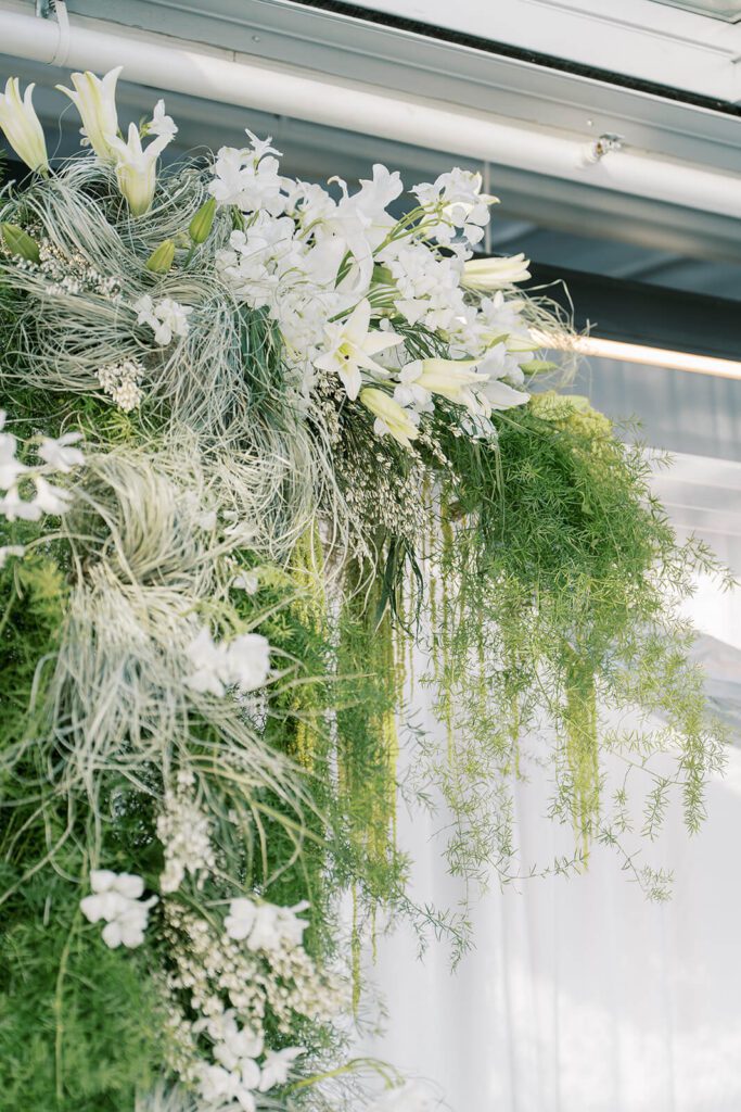 Whimsical white and green floral arch