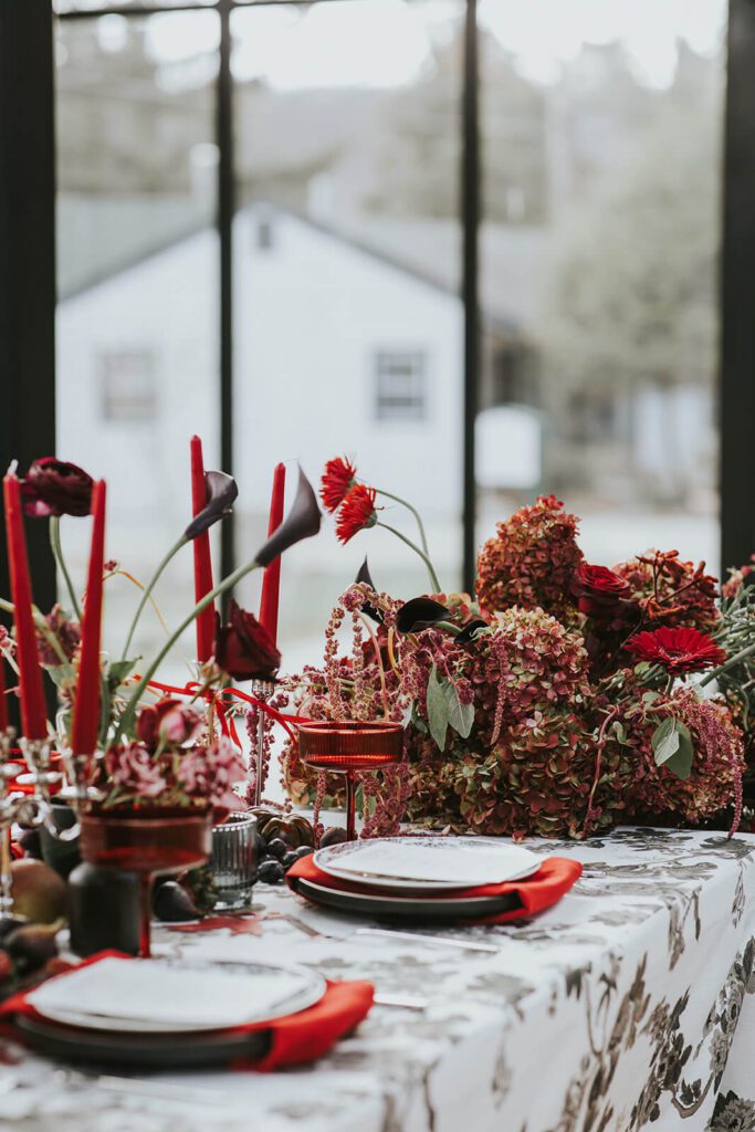 Cedar Lakes Estate wedding reception tablescape in shades of red