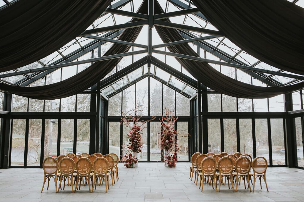 Wedding ceremony at the Glasshouse at Cedar Lakes Estate