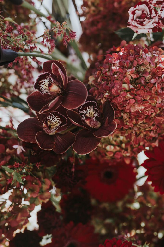 Merlot and red wedding floral arrangement
