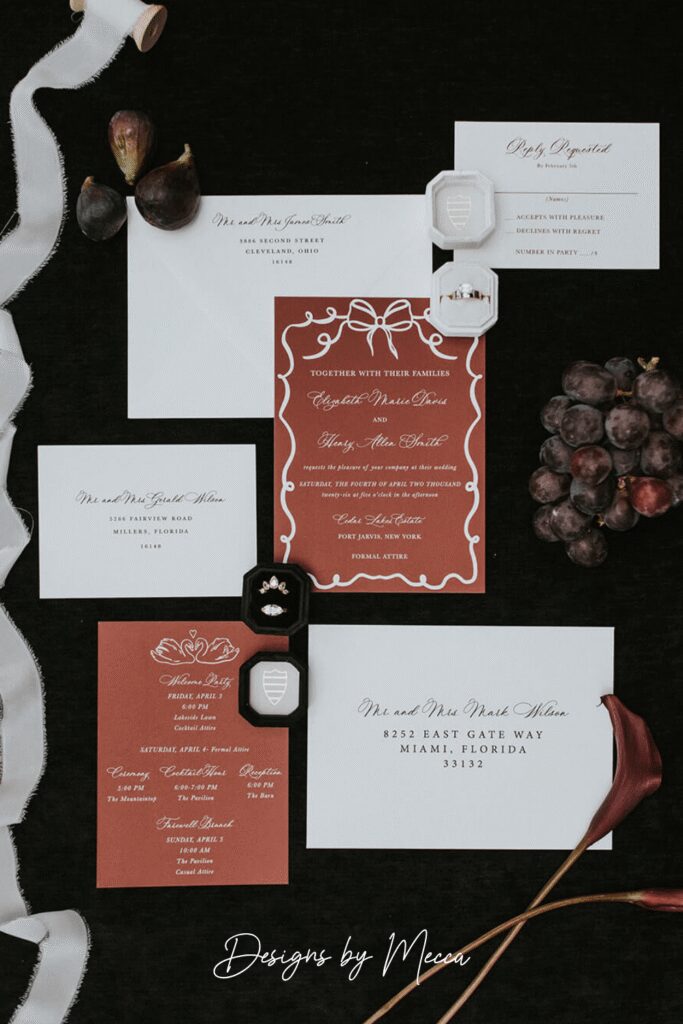 Deep terracotta wedding invitation suite with hand-drawn illustrations