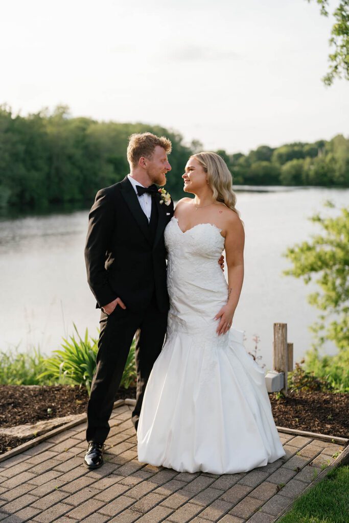 Portrait of the bride and groom by the lake at The Montage Indianapolis