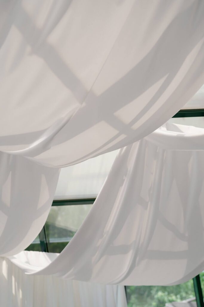 Ethereal white draping for a wedding ceremony at The Montage Indianapolis