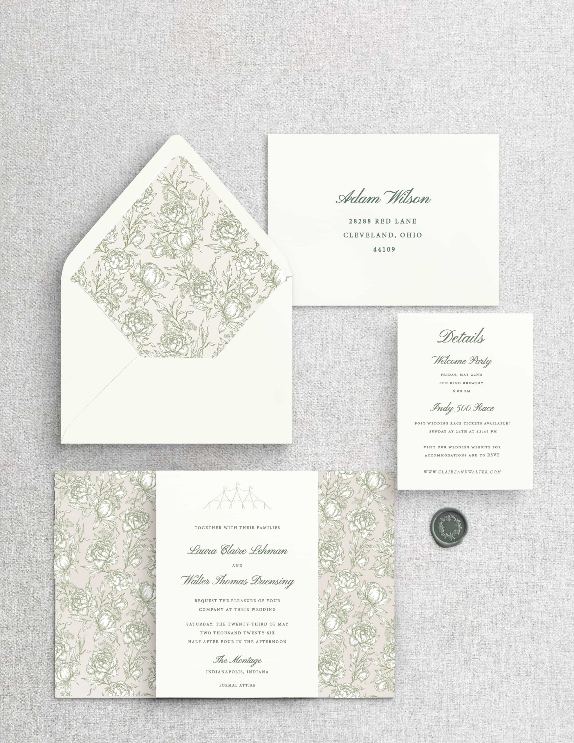 Mockup of a custom white and green wedding invitation suite with a floral envelope liner and floral vellum wrap