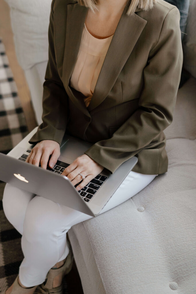 Wedding stationer using her computer to design custom invitations
