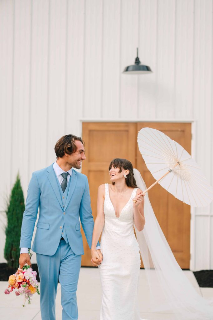 Bride and groom walking outside at The Wellspring on their wedding day