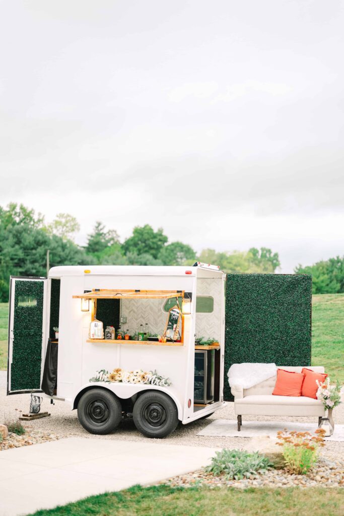 Mobile bar cart parked outdoors for a wedding at The Wellspring