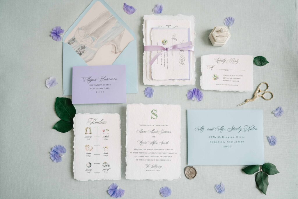 Light blue and lavender wedding invitation suite made with handmade paper