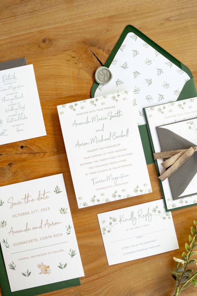 Green wedding invitation suite with patterned botanical envelope liner